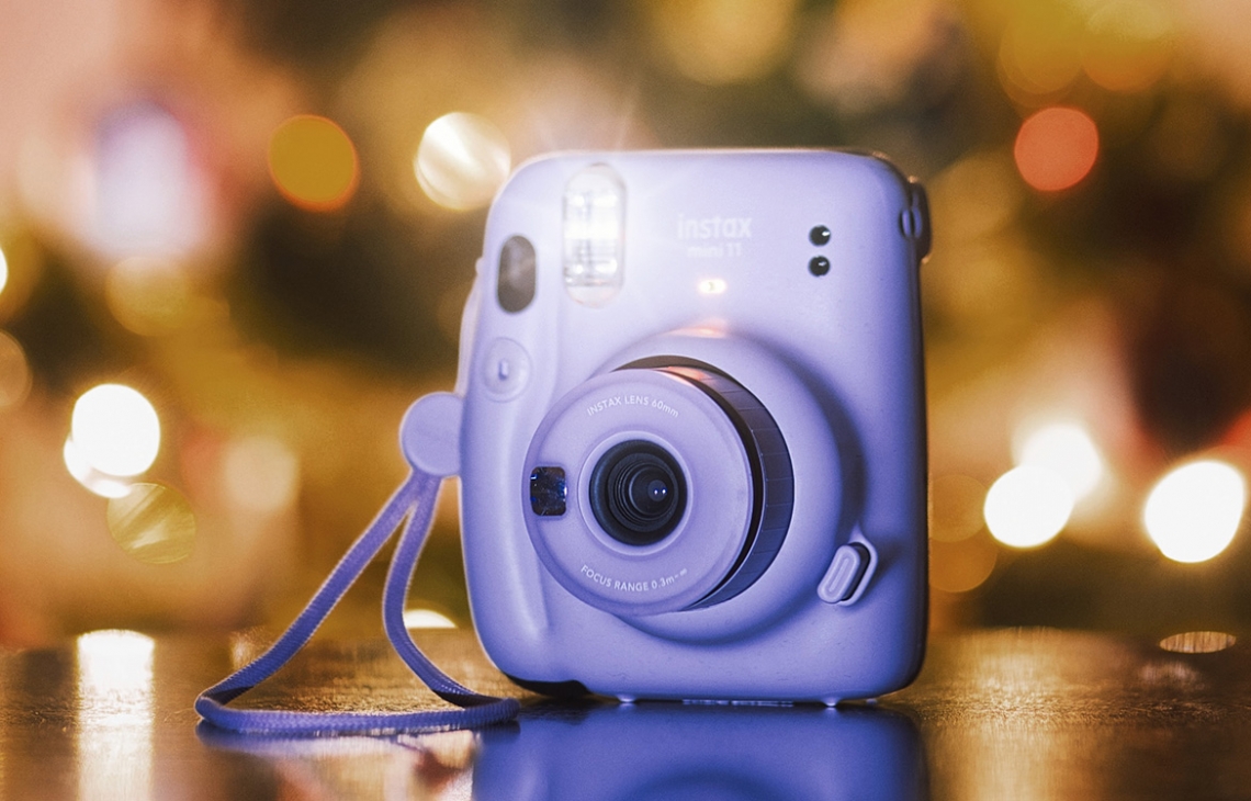 Instax Mini in front of a Christmas Tree