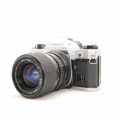 Used Canon AE-1 Program 35mm SLR with Tokina 35-70mm lens Used Canon AE-1 Program 35mm SLR with Tokina 35-70mm lens