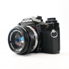 Used Olympus OM-4 Ti 35mm SLR with 50mm lens, black